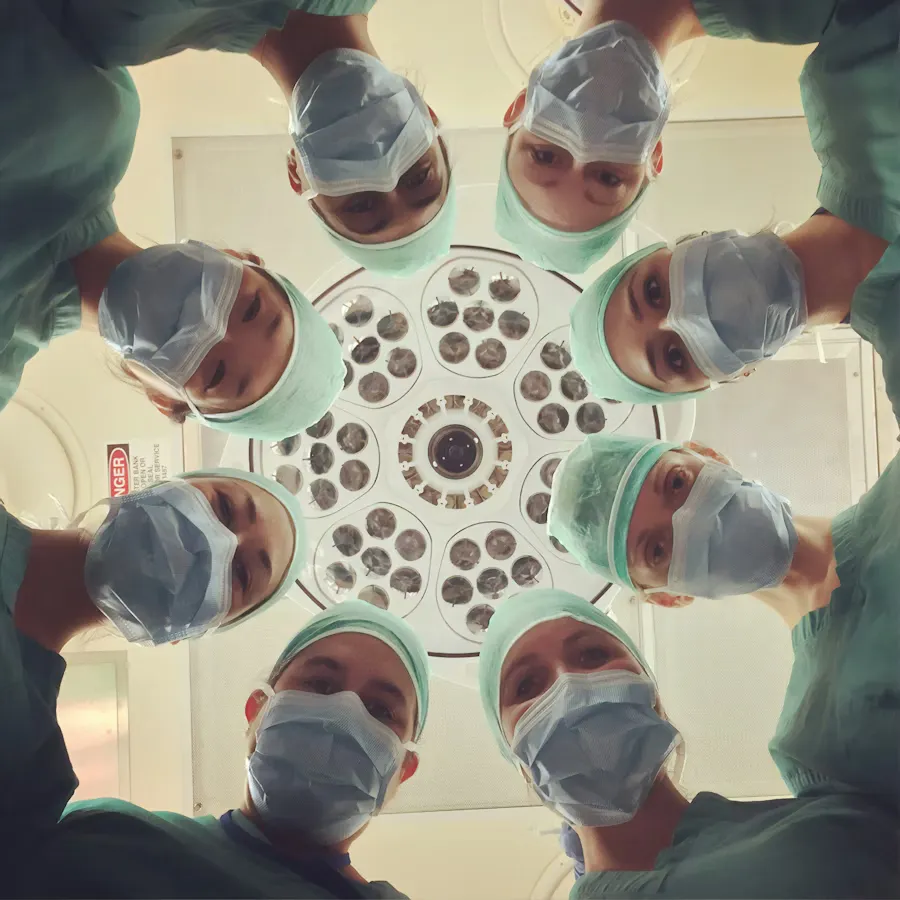 Doctors standing over the camera